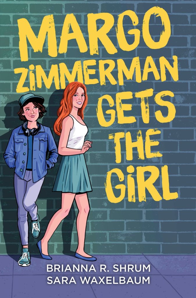 A book cover. The title "Margo Zimmerman Gets the Girl" is written in large yellow caps down the right side of the cover. The names of the authors "Brianna R. Shrum" and "Sara Waxelbaum" are written at the bottom in smaller white caps. The background shows art of two women in front of a dark blue brick wall. Both are on the left side of the cover. The women who is furthest left is leaning against the wall with her hands in her pockets, one foot on the wall. She is wearing a green baseball cap, a denim shirt over a dark blue t-shirt, black headphones around her neck, light grey leggings and green sneaker shoes. The woman to her right is slightly taller, with long orange hair, a white tank top, a green skirt and blue flats. /end
