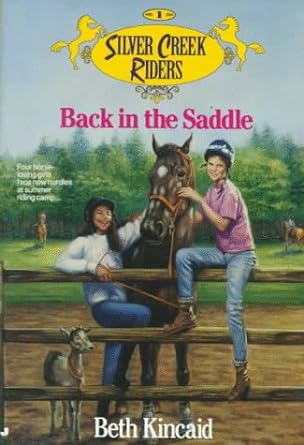A book cover. The title of the series "Silver Creek Riders" is written in black text at the top of the screen. It is in a yellow circle, with a yellow horse on either side. The title "Back in the Saddle" is directly below this in pink text. The author's name "Beth Kincaid" is written at the bottom of the cover in white writing. There is small, illegible white writing in the centre of the left side of the cover. Background art shows two young people and some horses. One person is sat on a long wooden fence, one person is behind the fence. Between them is a large brown and white spotted horse. There is a small foal next to the person behind the fence. Green trees and a field can be seen behind them, as well other, faint horses. /end