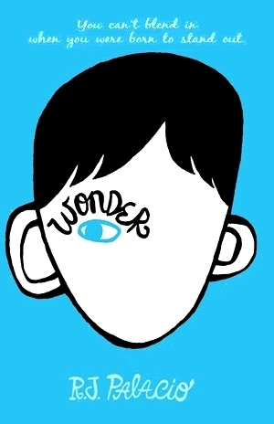 A book cover. Two lines of text reading "you can't blend in [/] when you were born to stand out" are written at the top in lower case white cursive. The author's name "RJ Palacio" is written at the bottom in larger uppercase cursive. The background is blue. In the centre, art of the outline of a head with black hair. There are no facial features on the face except for one blue eye on the left of the cover (the right side of the face). Above the eye, the title of the book "Wonder" in black cursive. /end