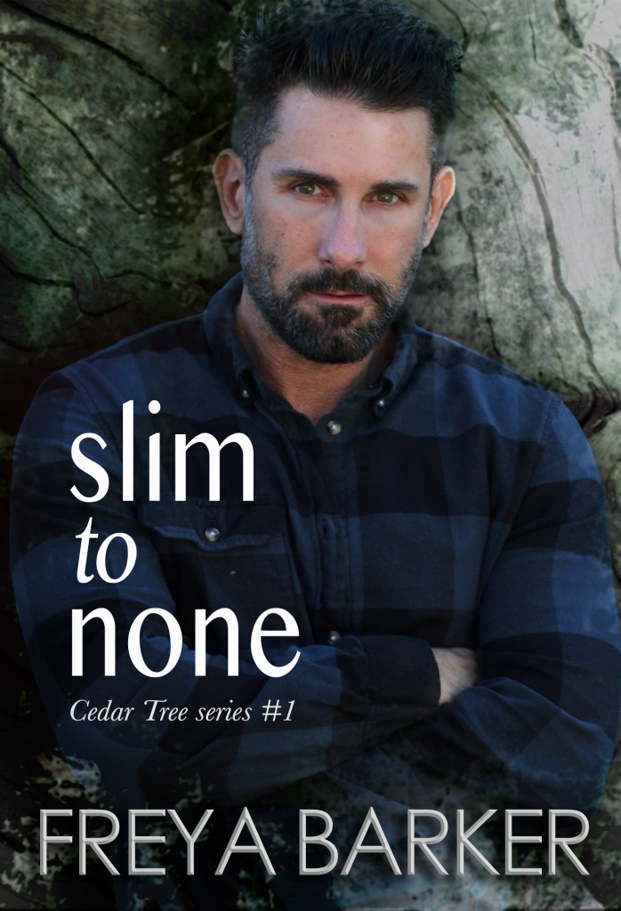 Book cover for 'Slim to None' by Freya Barker. The author's name is at the bottom of the cover in large grey capital letters. The title of the book is written in a column down the lower left centre of the page, in white lower case letters. The name of the series "Cedar Tree" is below this in smaller white writing. The cover art shows an older white man with dark black hair and a beard standing in front of a tree with his arms crossed over his chest. He is wearing a long sleeved, dark blue chequered shirt. /end